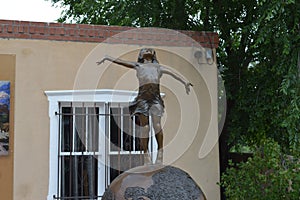 Sculpture of Girl on Globe in Sante Fe New Mexico