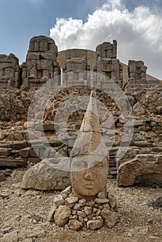 Sculpture of a Greek god on top of a mountain photo