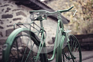 Sculpture of a green painted bicycle in the rai photo