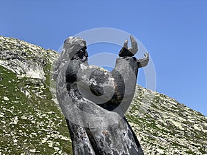 The sculpture il ``viandante`` the Wanderer, sculpture by Pedro Pedrazzini on the Gotthard pass Gotthardpass in the Swiss Alps