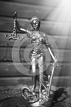 Sculpture of justice goddess on wood lining