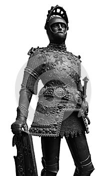 Sculpture of King Arthur old metal statue. Medieval knights armor full size standing warrior. Order of the Knights