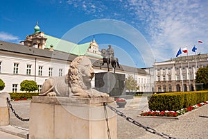 Sculpture of lion and equestrian statue of Prince Jozef Antoni Poniatowski in front of Presidential Palace, Warsaw, Poland.