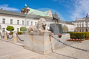 Sculpture of lion and equestrian statue of Prince Jozef Antoni Poniatowski in front of Presidential Palace, Warsaw, Poland.