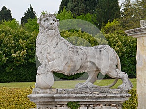 Sculpture of a lion in the graden of the villa Maser photo