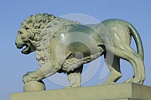 Sculpture of a lion at the Palace Bridge. Saint-Petersburg, Russia