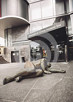 Sculpture lying male nude which symbolizes excess weight and health problems