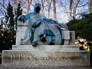 Sculpture of a man with a hood dropping photo