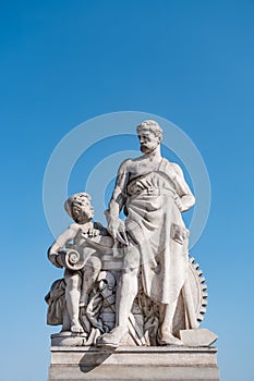 Sculpture of mechanic and his scholar on Zoll Bridge in Magdebur