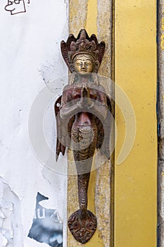 Sculpture of mermaid godess with wings.