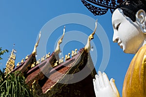 Sculpture of Monk in front of temple at Wat Phra Sing - Chiang Rai, Thailand