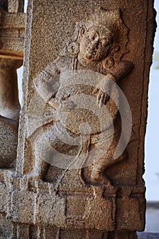 Sculpture of musician playing drum at the Vittala Temple, Hampi, Karnataka, India