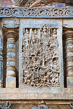 Sculpture of Pandavas picking up their weapons from the Shami tree. Chennakeshava temple. Belur, Karnataka. An episode from Mahabh photo