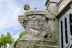 Sculpture in the picturesque old bridge in Amsterdam