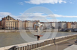 Sculpture and the river Rhone. Lyon, France