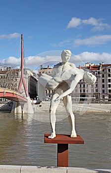 Sculpture and the river Rhone. Lyon, France