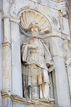 Sculpture of a Saint at Se Velha or Old Cathedral, Coimbra photo