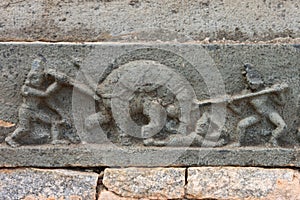 Sculpture showing killing of a mad elephant with spears