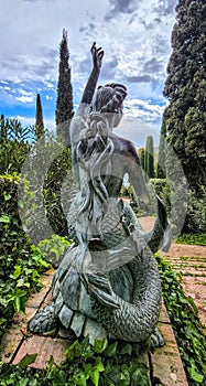 Sculpture of sirene in antique style. Park \