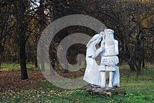 Sculpture. Slavic gods. Sculpture among the trees.