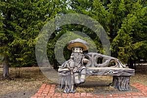 Sculpture of a storybook character from children`s fairy tales the old man treefolk. The fantastic sculpture in the natural park