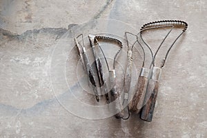 Sculpture tools. Art and craft tools on vintage wood background. Close-up