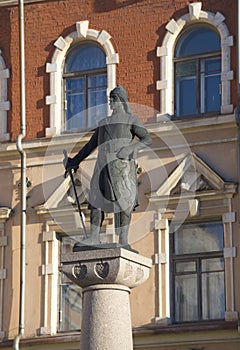 Sculpture of Torgils Knutsson on the background of the facade of a historic building. Vyborg, Leningrad region
