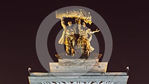 Sculpture Tractor operator and collective farmer on the top of entrance to All-Russia Exhibition Centre timelapse