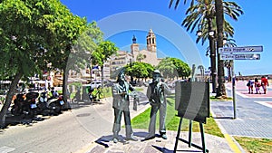 Sculpture tribute to RamÃ³n Casas and Santiago RusiÃ±ol in a Sitges garden, Barcelona photo