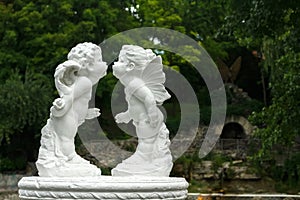 Sculpture of two angels in the park.