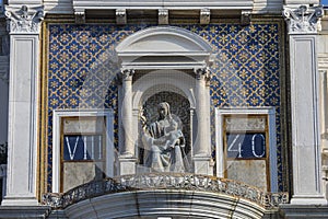 Sculpture of Virgin and Child on St. Marys Clock Tower in Venice photo