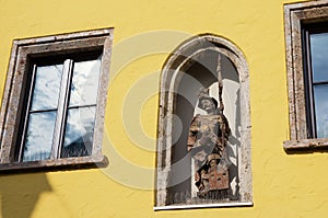 Sculpture of a warrior in a facade niche of a house, Kitzbuhel, Austria