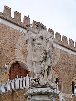 A sculpture of a woman with a sword