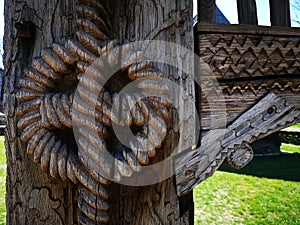 Sculpture in wood on the Maramures gate - rope twisted