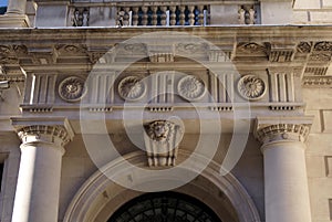 Sculptured arched entrance with columns and corbel