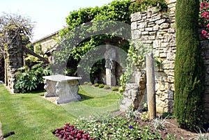 Sculptured marble table & statue at the Italian garden of Hever castle in England