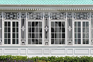 Forged patterns decorate the frames of the windows of a building in Dusit park in Bangkok (Thailand) photo