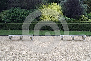 Sculptured stone seats in a garden photo
