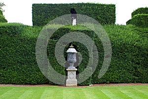 Sculptured urn and hedge, Sudeley castle, England photo