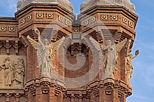 Angel statues, detail of Arc de Triomf in neo-mudejar style in Barcelona photo