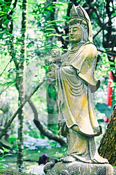 Sculptures of Chinese gods. (Kuan Yin) in the park.