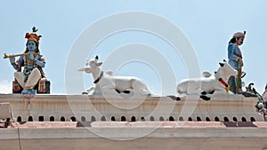 Sculptures on roof of Sri Mariamman Temple, Singapore photo