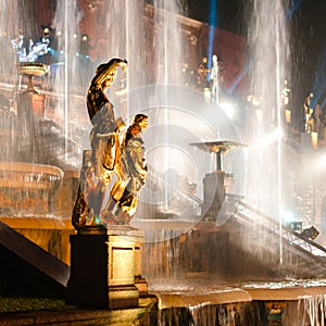 Sculptures with fountain on background