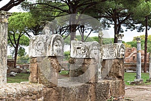 Sculptures in front of the entrance to the ancient theatre