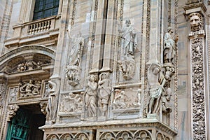 Sculptures at the main entrance to Milan Cathedral. Duomo Cathedral. Italy