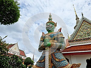 The sculptures of mythical giant demons, Thotsakan, guarding the eastern gate of the main chapel of Wat Arun Ratchawararam, is a