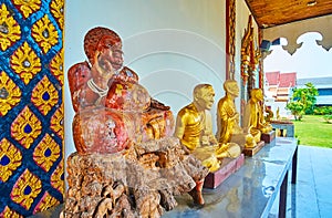 The sculptures on the porch of Wat Chammathewi Viharn, Lamphun, Thailand