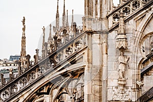 Sculptures on the roof arcades of the Duomo. Italy, Milan