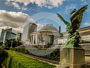 Sculptures and skyscrapers in Botanic garden in Brussels, Belgium