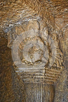 Sculptures on the top left pillar of Vihara Cave No. 20 with rock-cut at Bhaja Caves, Ancient Buddhist built in 2nd century BC,